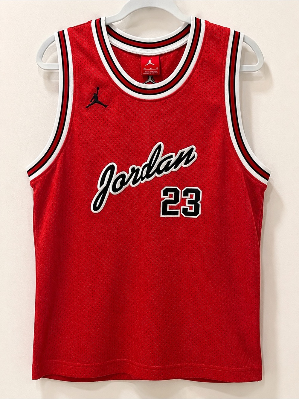 Jordan Red Basketball Jersey with Black & White Trim Accents.